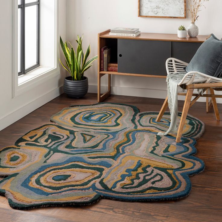 a living room area with a chair and rug