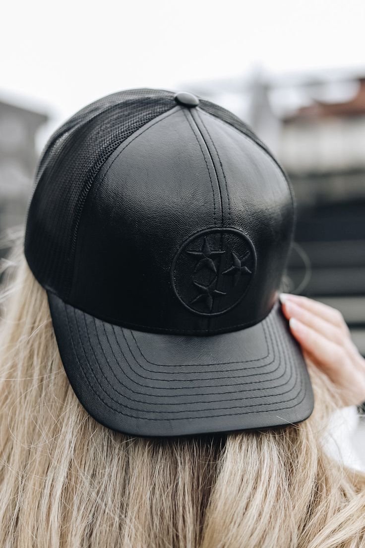 The elevated version of our classic TriStar trucker. Featuring a sleek black on black faux leather design, this trucker gives you a cool, comfortable style, no matter the occasion. Unisex 6 Panel High Crown Structured Adjustable Snapback Closure Poly/cotton blend