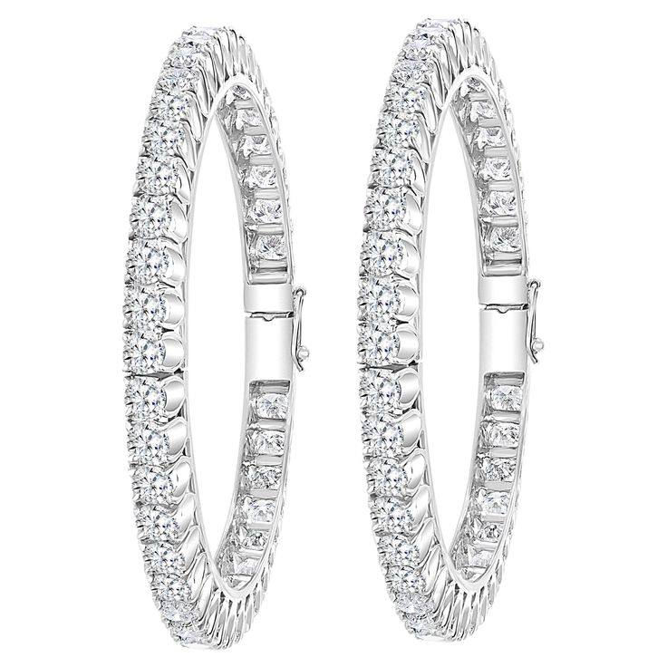 Single line 40 pointer each , 35.62 Ct Contemporary 18 Karat White Gold & Diamond Eternity Bangle Bracelet It features Two bangles crafted from 18k White gold embedded with 35.62 Carats of Round brilliant diamonds in two bangles . The pattern can be stacked with similar style bangles or worn as a stand-alone piece. Total Diamond weight 35.62 Ct Each Diamond size : approximately 40 pointer each Clarity SI1 and color G/H # of Diamonds in each bangle 44 Total # of diamonds : 88 18 K gold 61 gm Hing Single Line, Diamond Bangle, Diamond Eternity, Hinged Bangle, Diamond Sizes, White Gold Diamonds, Bangle Bracelet, Diamond Bracelet, Gold Diamond