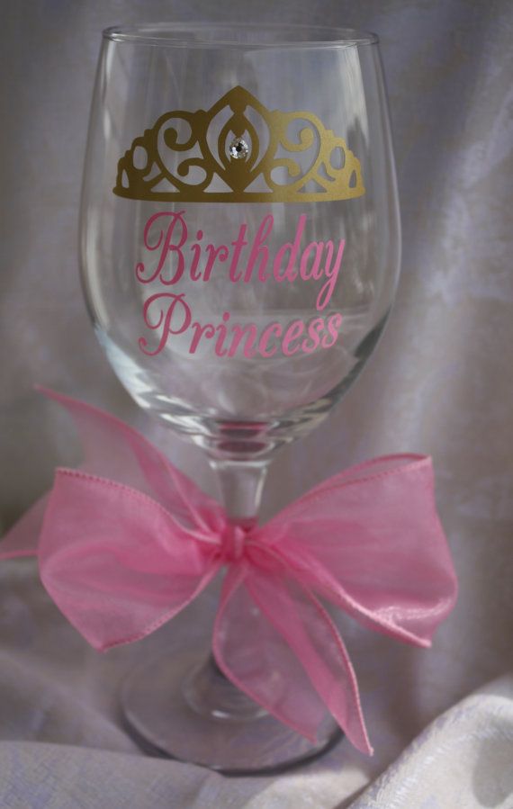 a wine glass with the words birthday princess on it and a pink ribbon tied around it