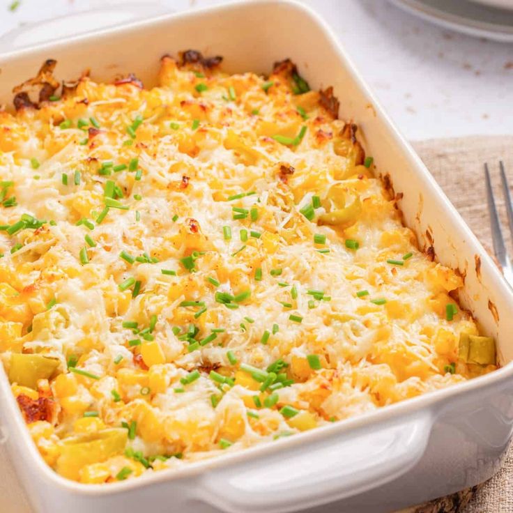 a casserole dish with cheese and green onions