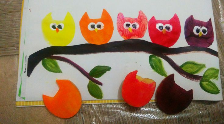 an art project for kids with apples and owls on a tree branch