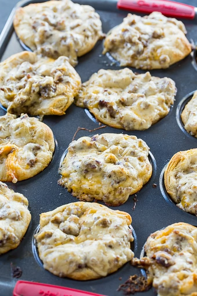 a baking tray filled with cookies and muffins