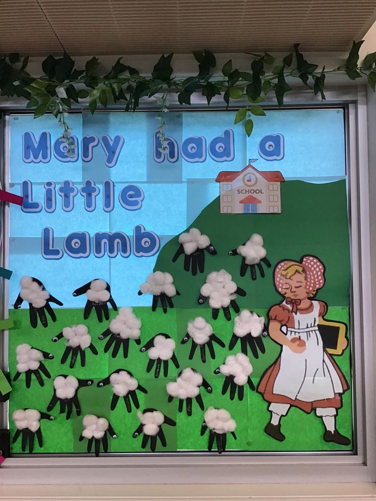 a bulletin board with sheep in the grass and mary had a little land written on it