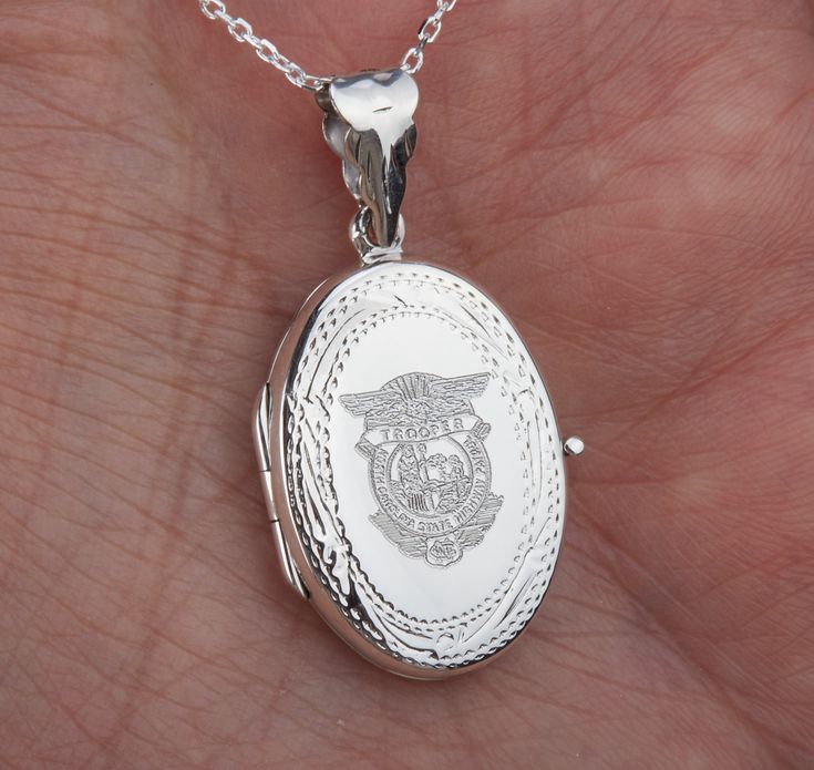 "Carrying the pictures of your loved ones close to your heart all the time, this personalized locket necklace features: 1. a solid oval sterling silver locket (19 x 26 mm, 4.6 grams) that can hold two pictures. Picture insertion service available (select from the pulldown) for $14 each photo. Please send photo(s) by attaching them to a conversation to me. It can be engraved on the front and back (use pulldown menu to select). Monograms, picture(black/white w. well defined lines), badge, fingerpr Keepsake Medallion Locket Necklace With Hallmark, Keepsake Medallion Jewelry With Hallmark, Hallmarked Medallion Jewelry For Keepsake, Silver Oval Pendant For Personalized Gift, Medallion Jewelry Hallmark Keepsake, Silver Oval Pendant Jewelry For Personalized Gift, Silver Locket Necklace For Memorial, Anniversary Medallion Locket Necklace With Hallmark, Sterling Silver Oval Pendant For Personalized Gift