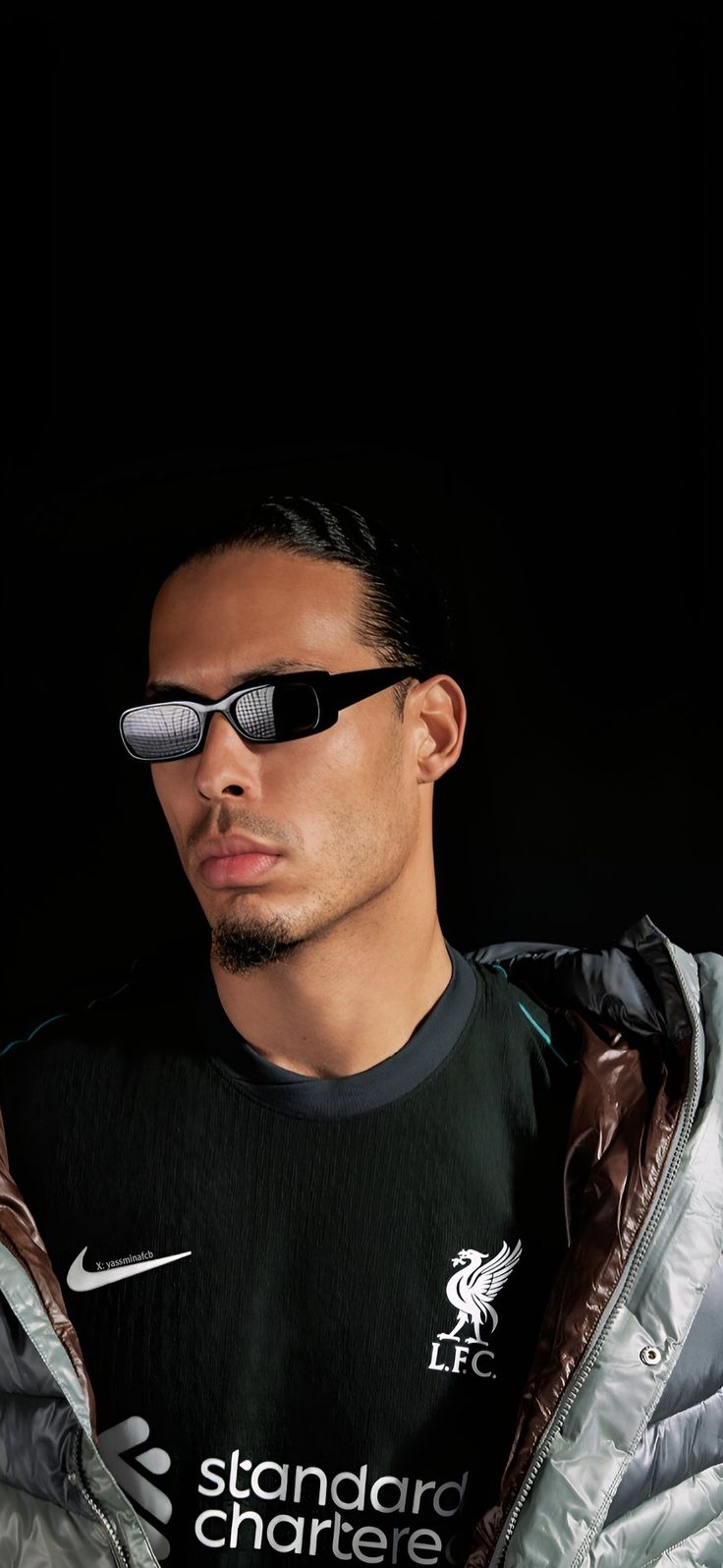 a man wearing sunglasses and a jacket