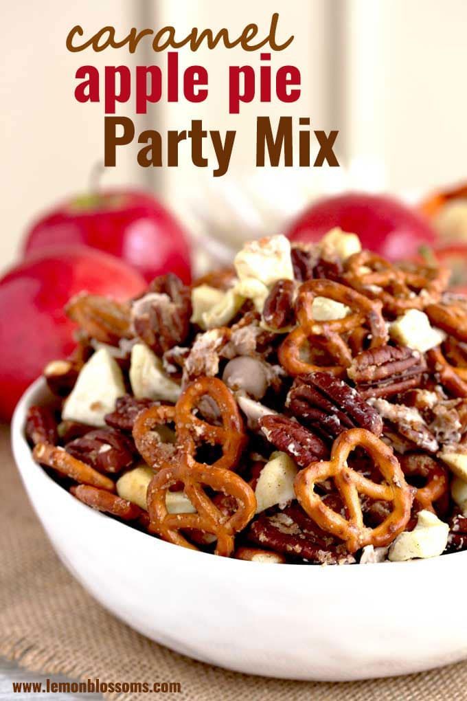 a white bowl filled with apples and pretzels