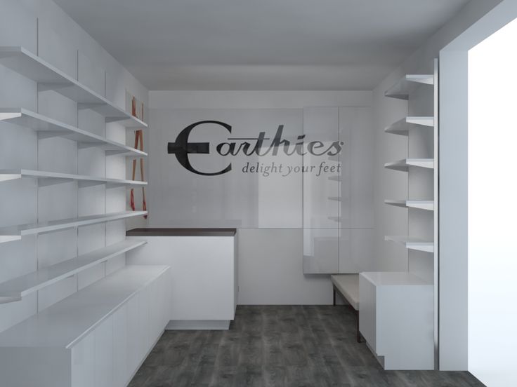 an empty room with white shelves and shelving