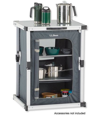 an open cabinet with pots and pans on it