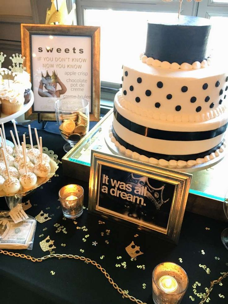 a table topped with lots of cakes and desserts