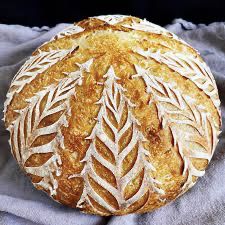 a loaf of bread sitting on top of a blanket