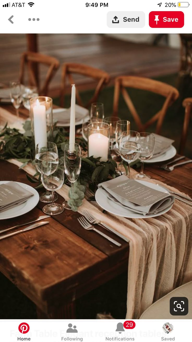 the table is set with candles and place settings