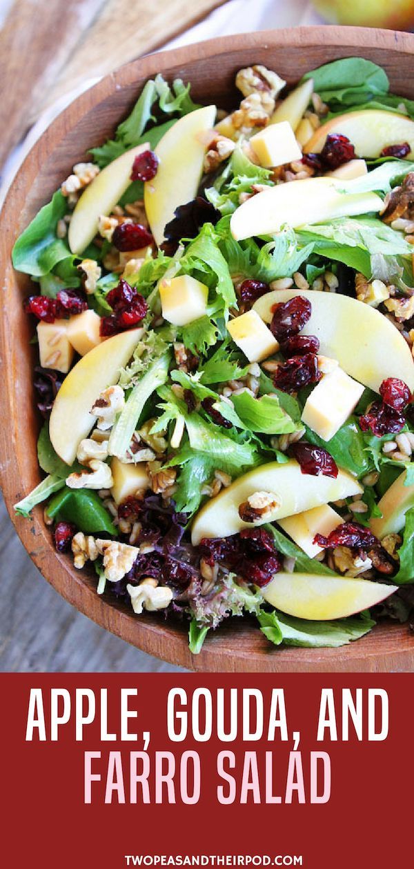 an apple, goudaa and faro salad in a wooden bowl