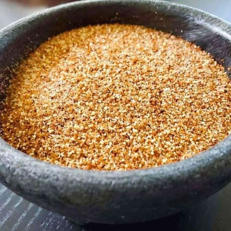 a bowl filled with some kind of food on top of a table