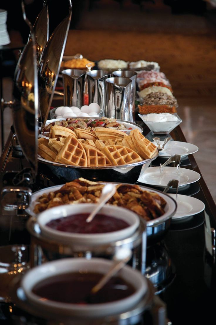 a buffet table filled with different types of food