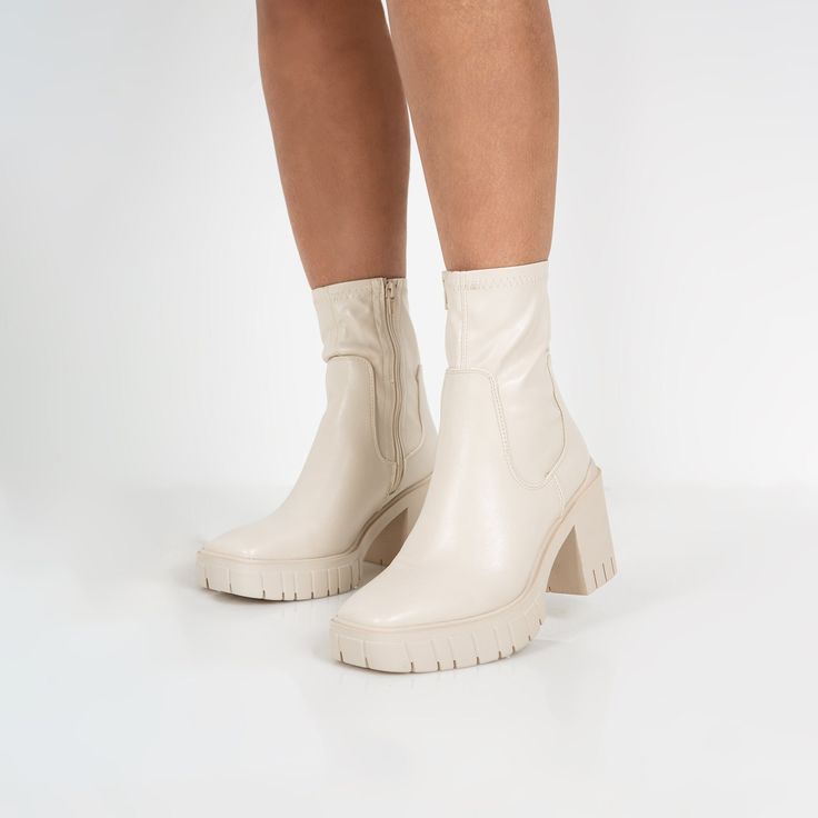 Our vegan EDISON boots feature a chunky sole, block heel, curved square toe with a sock-like cuff perfect for your every day look! ‣ PU Material ‣ Sock-like Cuff ‣ Square Toe ‣ Platform Cleated Sole ‣ UK Sizes ‣ Heel Height: 3.4 inches Trendy Chunky Heeled Boots For Winter, Chunky High Ankle Heeled Boots For Fall, Spring Chunky Platform Knee-high Heeled Boots, Spring Knee-high Chunky Platform Heeled Boots, Trendy Chunky Ankle-high Boots, Knee-high Chunky Platform Heeled Boots For Spring, Spring Knee-high Heeled Boots With Chunky Platform, Casual Knee-high Chunky Platform Heeled Boots, Trendy Chunky Ankle Boots