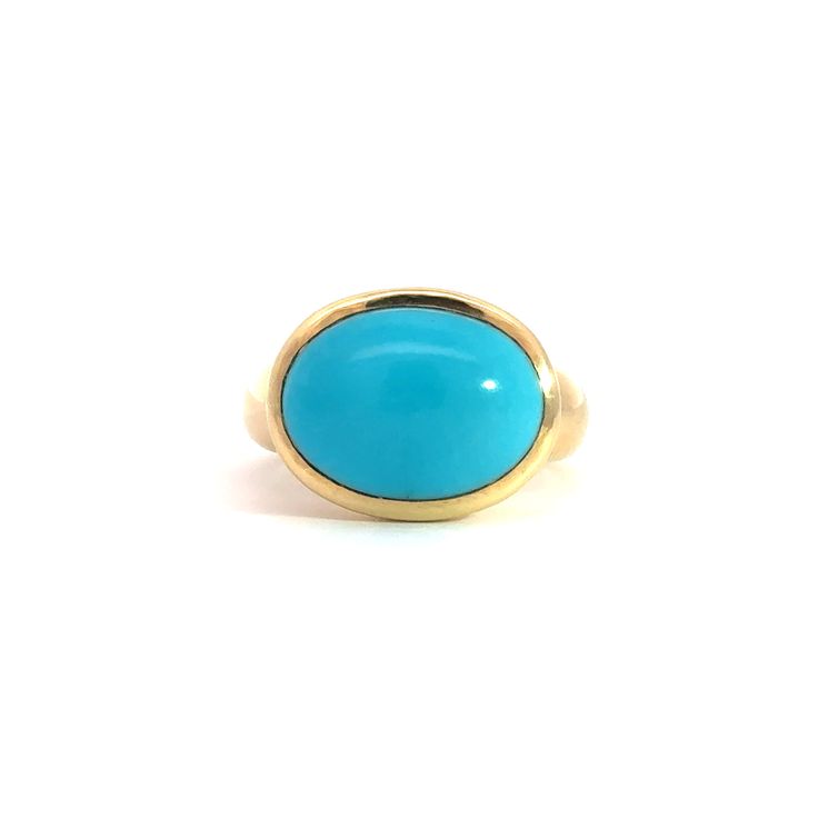 Elevate your style with the stunning Large Oval Cabochon Gumdrop Ring, a true statement piece crafted from luxurious 18K gold. This eye-catching ring features a magnificent 5.44-carat oval cabochon gemstone that radiates with vibrant color and unparalleled clarity.The smooth, polished surface of the cabochon is perfectly complemented by the rich, gleaming gold band, creating a harmonious blend of sophistication and bold elegance. The gumdrop setting adds a playful touch to this timeless design, ensuring the gemstone remains the star of the show while providing a secure and stylish fit.Whether you're dressing up for a special occasion or looking to add a pop of color to your everyday ensemble, the Large Oval Cabochon Gumdrop Ring is sure to turn heads and spark conversations. Slip it on and Luxury Turquoise Cabochon Ring In Yellow Gold, Luxury Yellow Gold Turquoise Cabochon Ring, Timeless Yellow Gold Dome Ring With Cabochon, Luxury Oval Turquoise Ring, Luxury Yellow Gold Oval Cabochon Rings, 14k Gold Cabochon Dome Ring Elegant Style, Elegant 14k Gold Cabochon Dome Ring, Modern Yellow Gold Cabochon Rings, Classic Gold Turquoise Ring With Round Shape