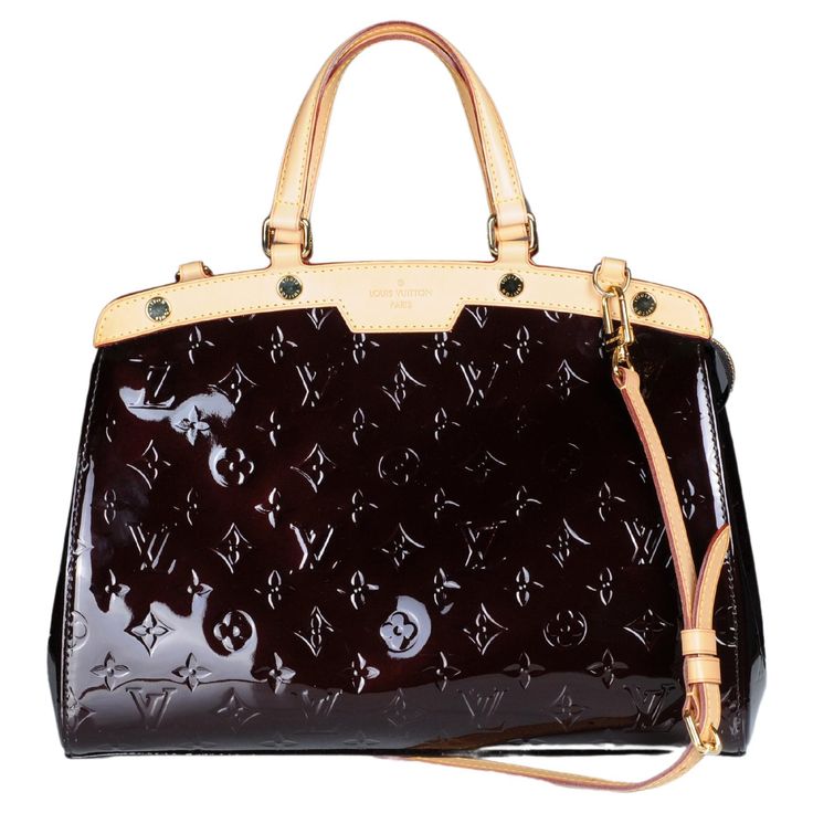 Louis Vuitton Brea handbag in purple patent leather, hardware in gilt metal, double handle in natural leather, natural leather removable strap to be worn accross the body allowing the bag to be worn on the hand or across the body. Zip closure. Lining in black canvas, three zip pocket, one patch pocket. Sold with dustbag. Signature: "Louis Vuitton Paris Made in France". Year : 2015. Very good condition: glossy leather, slight patina inside, very small patina on the leather to the handles of the bag. Louis Vuitton Paris, Leather Hardware, Black Canvas, Handle Bag, Natural Leather, Fashion Handbags, High Boots, Knee High Boots, Made In France