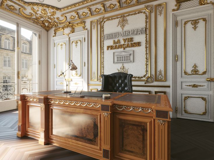 an office with gold and white decor on the walls, along with a large wooden desk