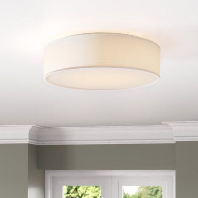 a living room scene with focus on the ceiling light