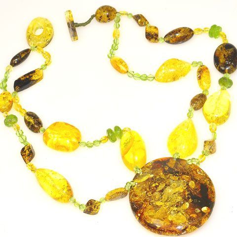 Necklace Stone(s): Genuine Baltic honey amber, Baltic citrine amber and genuine peridot (pendant amber measures 2.25 x 2 x 0.7 inches) Necklace Length: 18 inches Deep: 2.25 inches Weight: 77.5 grams Clasp: Toggle Stamp/Mark: N/A Origin: Poland Serial Number: n20382 Amber, an organic gemstone, is the fossilized resin of prehistoric trees which grew up to 50 million years ago. The stone has been used for jewelry since the time of Christ. The world's finest amber comes from the region around the Ba Prehistoric Trees, Silicate Minerals, Peridot Pendant, Necklace Stone, Peridot Necklace, Green Peridot, Necklace Length, Stone Necklace, Citrine