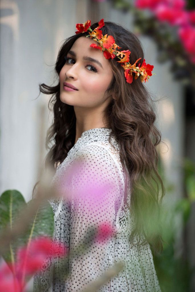 a woman with flowers in her hair