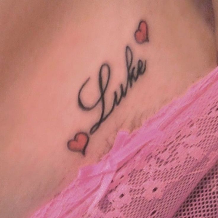 a woman's stomach with the word sukie written in cursive font