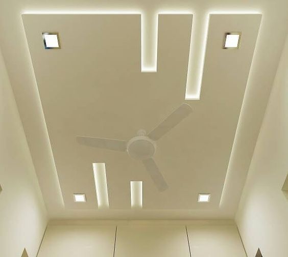 a ceiling fan in the middle of a room with white walls and tile flooring