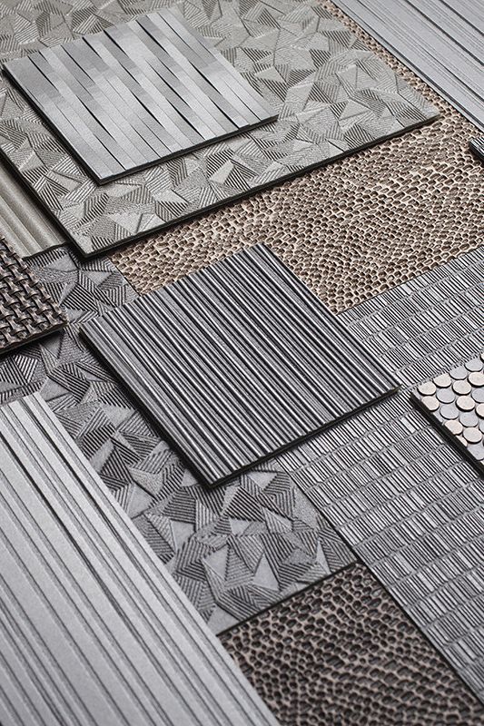 many different types of tile on the floor in various colors and patterns, including grey