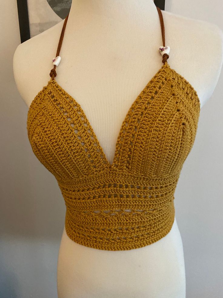 100% cotton crochet festival top. YES it can get wet! Wash with delicates in a netted bag, hang dry.  Fits Sizes B-D cup. Vegan leather ties and hand painted Chinese ceramic beads Festival Brown Crochet Lace Top, Summer Festival Cotton Crochet Top, Yellow Bohemian Top With Crochet Trim, Brown Crochet Lace Top For Summer, Handmade Yellow Bohemian Top, Yellow Handmade Bohemian Top, Hippie Yellow Beach Tops, Handmade Yellow Crochet Top For Beach, Yellow Bohemian Crochet Top For Festival