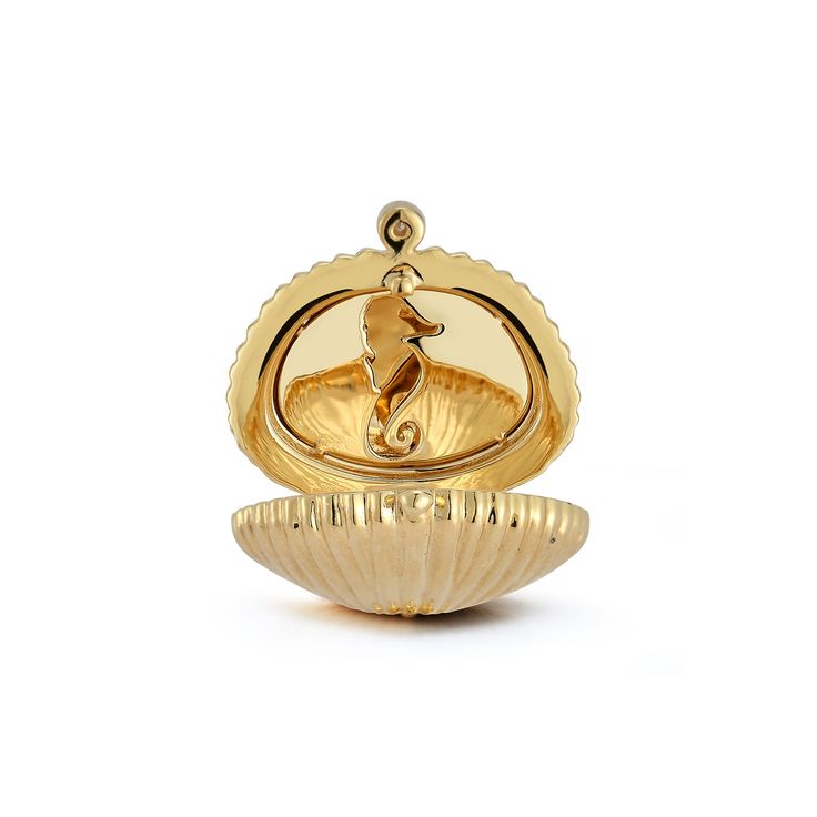 There's nothing more special than a locket to keep cherished memories close to your heart. Keeping true to our love of the sea, we reimagined the concept using a golden shell to encase our treasures. A gleaming pearl emerges from the locket, on the opposite side a whimsical engraved seahorse awaits. 18k Yellow Gold The locket is finished with a diamond bale and safety clasp. 15 mm diameter Chains are sold separately. Bridal Waves, Diamond Tennis Necklace, Light Sapphire, Golden Jewelry, Tennis Necklace, Ring Pendant Necklace, Tennis Bracelet Diamond, Recycled Gold, Cherished Memories