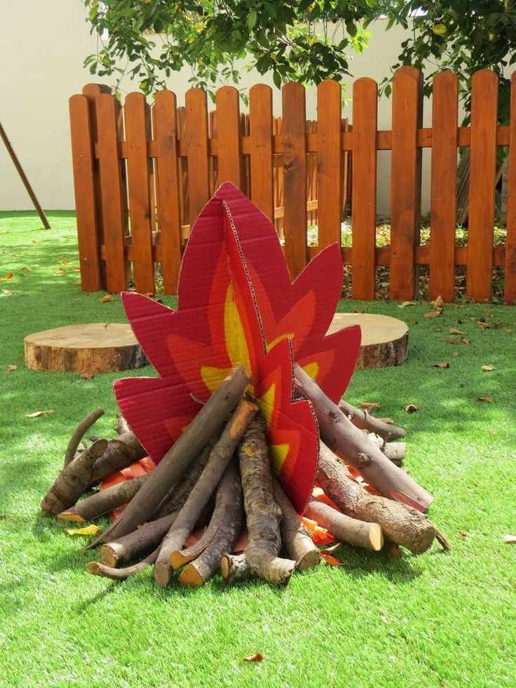 a fire pit made out of wood sticks