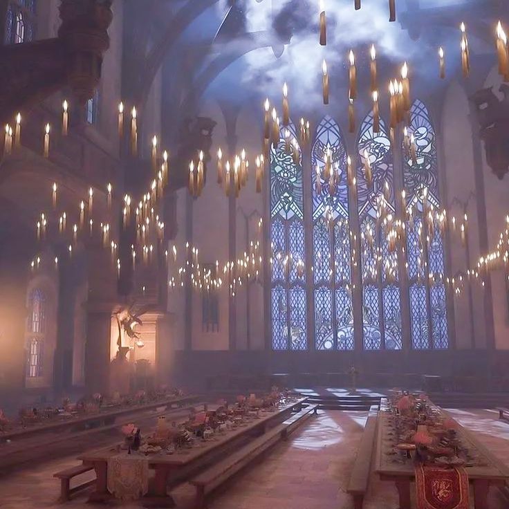 the inside of a large church with chandeliers hanging from the ceiling