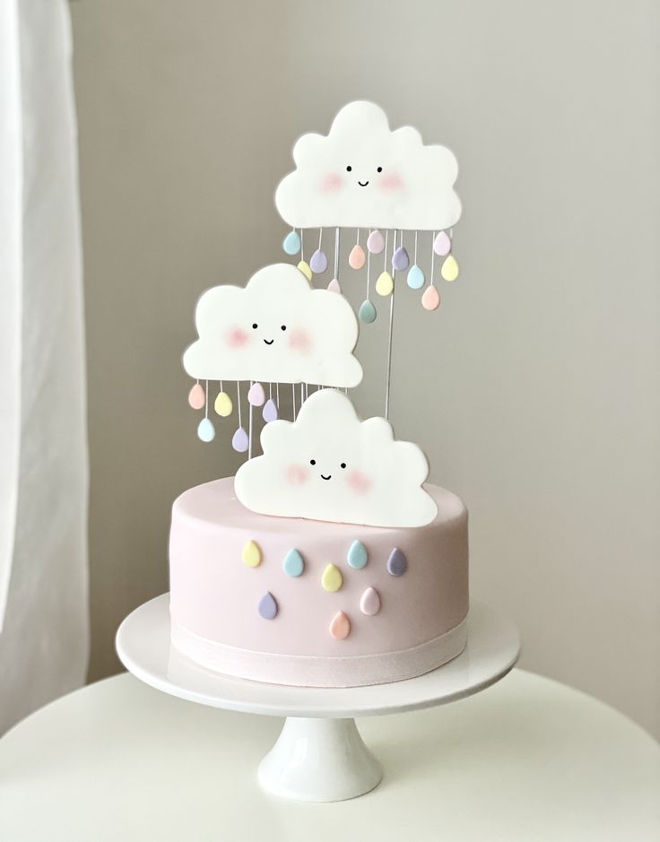 there is a cake that has clouds on it