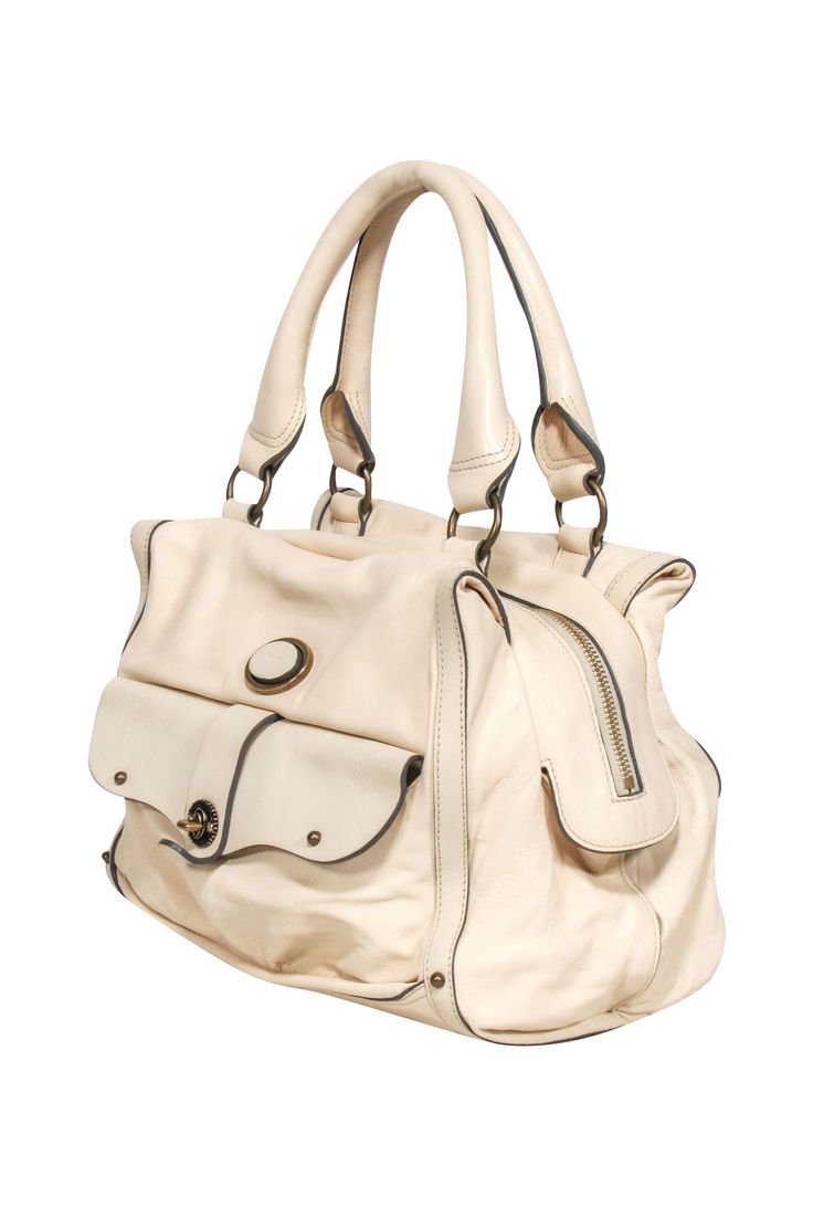 Be the ultimate It girl with Chloe's ivory leather shoulder bag. This blank slate features luxurious ivory leather and gold hardware, making it the perfect accessory for any outfit. Don't miss out on this must-have piece of gear! Made in Italy 100% Leather Top zipper closure Front lock pocket One interior zipper pocket Date code: 02-07-53 Minor blemishes on leather and lining Comes with dustbag Height 9" Width 13.125" Depth 9.25" Strap drop 9" Chic White Satchel With Metal Hardware, Cream Shoulder Bag With Gold-tone Hardware For Work, Cream Satchel Shoulder Bag For Work, White Leather Satchel With Metal Hardware, Chic Cream Bags With Metal Hardware, White Satchel With Metal Hardware For Travel, Cream Satchel With Gold-tone Hardware And Top Handle, Chic Cream Satchel With Gold-tone Hardware, Chic Cream Shoulder Bag With Gold-tone Hardware