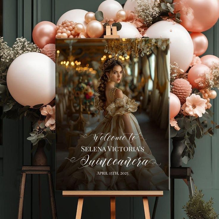 a sign that is sitting in front of some balloons and other decorations on a easel