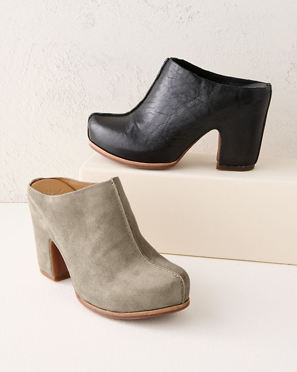 Add modern style to every step and every look with these streamlined mules. Crafted toe to heel in hand-finished leather or suede, with the comfort of a padded footbed.  By Kork-Ease.  Slip-on style.  Center seam on vamp.  Leather-wrapped footbed with extra foam.  Man-made sole and heel cap. Chic Slip-on Clogs With Reinforced Heel, Suede Mules With Stacked Heel And Almond Toe, Modern Closed Toe Mules With Sculpted Heel, Modern Leather Clogs With Padded Heel, Modern Clogs With Padded Heel And Round Toe, Modern Clogs With Padded Heel, Suede High Heel Mules Medium Width, Sleek Mules With Leather Sole And Round Toe, Sleek Mules With Round Toe And Leather Sole