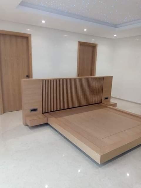 an empty room with wooden furniture in it