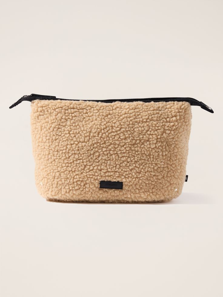 FOR: Commuting, work, and travel FEEL: Fluffy, functional shearling is plush-to-touch and easy to clean FAVE: Use as a cold-weather clutch or cozy travel-friendly organizer Large Pouch Dimensions: 13” L x 7 1/2” H x 5” D. Cozy Travel, Athletic Accessories, Work And Travel, Large Pouch, Back To School Shopping, School Shopping, Cosmetic Pouch, Makeup Essentials, Workout Accessories