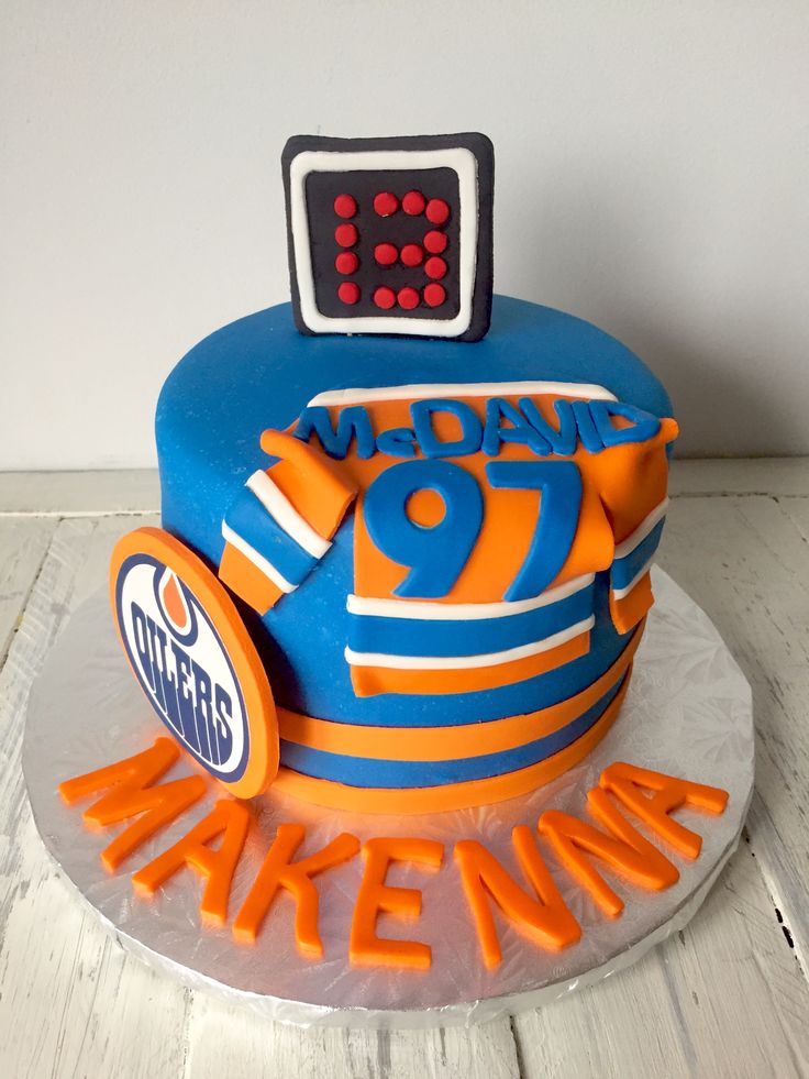 a birthday cake with an electronic clock on top