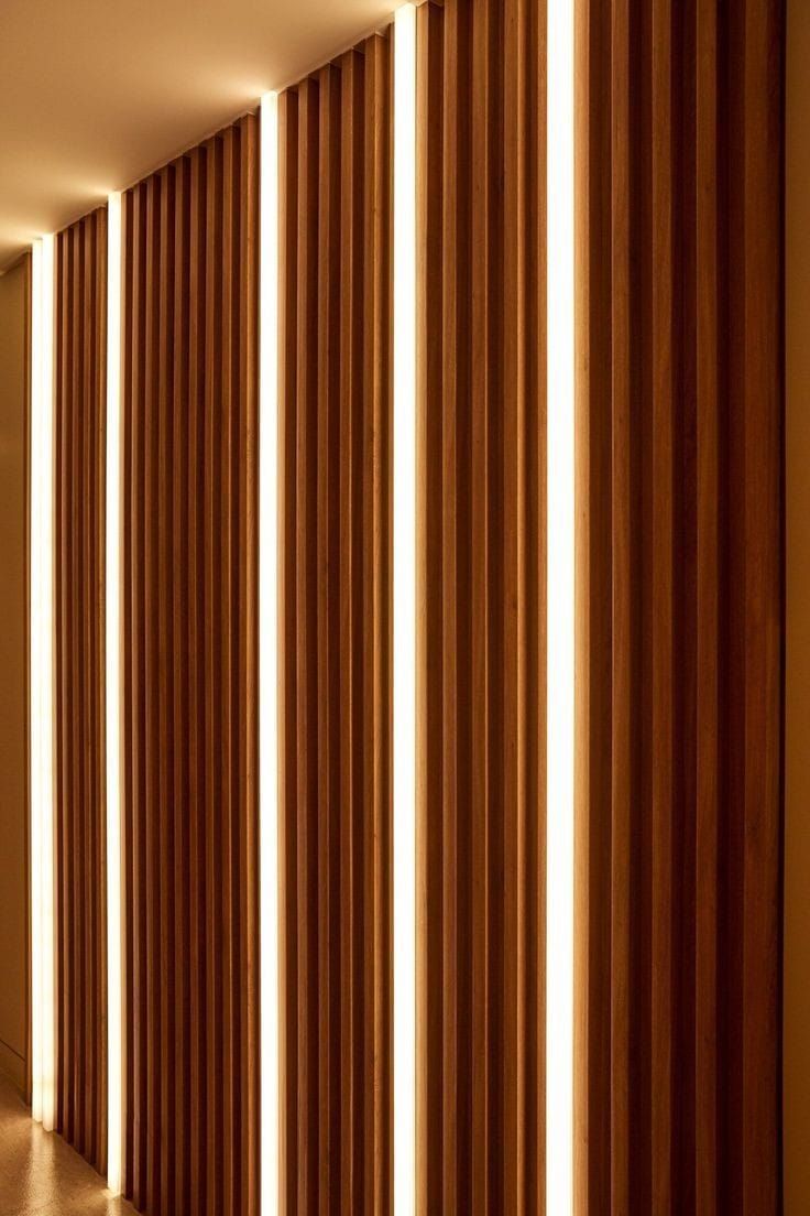 an empty hallway with wooden walls and vertical blinds