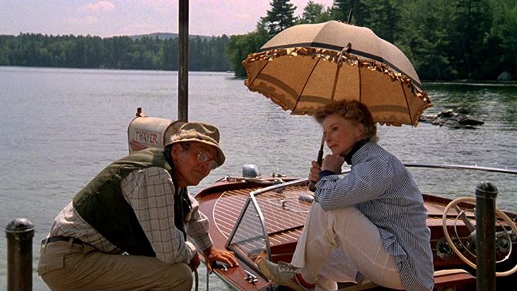 a man and woman on a boat with an umbrella