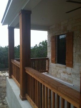 an outside view of a house with wooden railings