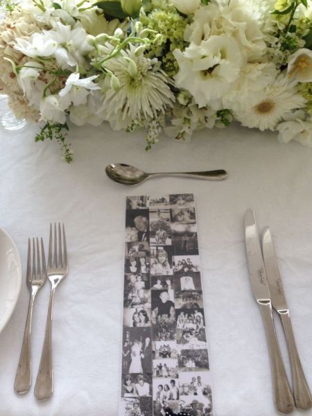 a table set with silverware and flowers