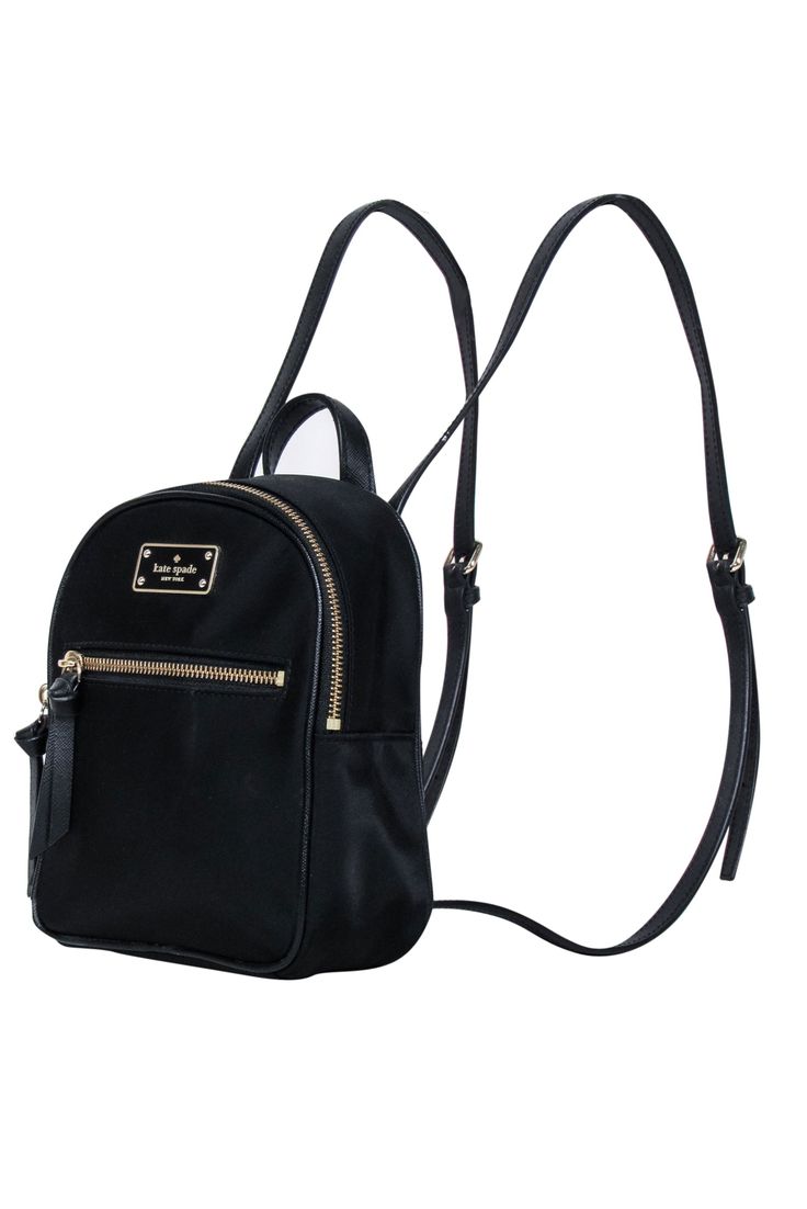 Be ready for any adventure with the Kate Spade black nylon mini backpack. Perfect for a weekend getaway, this backpack stores all your essentials in style. From hiking to picnics, it's a must-have for any fun-filled excursion. 100% Nylon Fabric lining Logo plaque front Top zipper closure Front exterior zipper pocket Adjustable straps Height 8.25" Width 6.5" Depth 3.5" Kate Spade Nylon Bag With Zipper Closure, Casual Nylon Kate Spade Bag, Kate Spade Backpack With Zipper Closure, Kate Spade School Backpack With Adjustable Strap, Kate Spade School Backpack, Casual Kate Spade Bag For School, Kate Spade Travel Bags With Zipper Closure, Kate Spade Black Everyday Backpack, Kate Spade Casual School Backpack