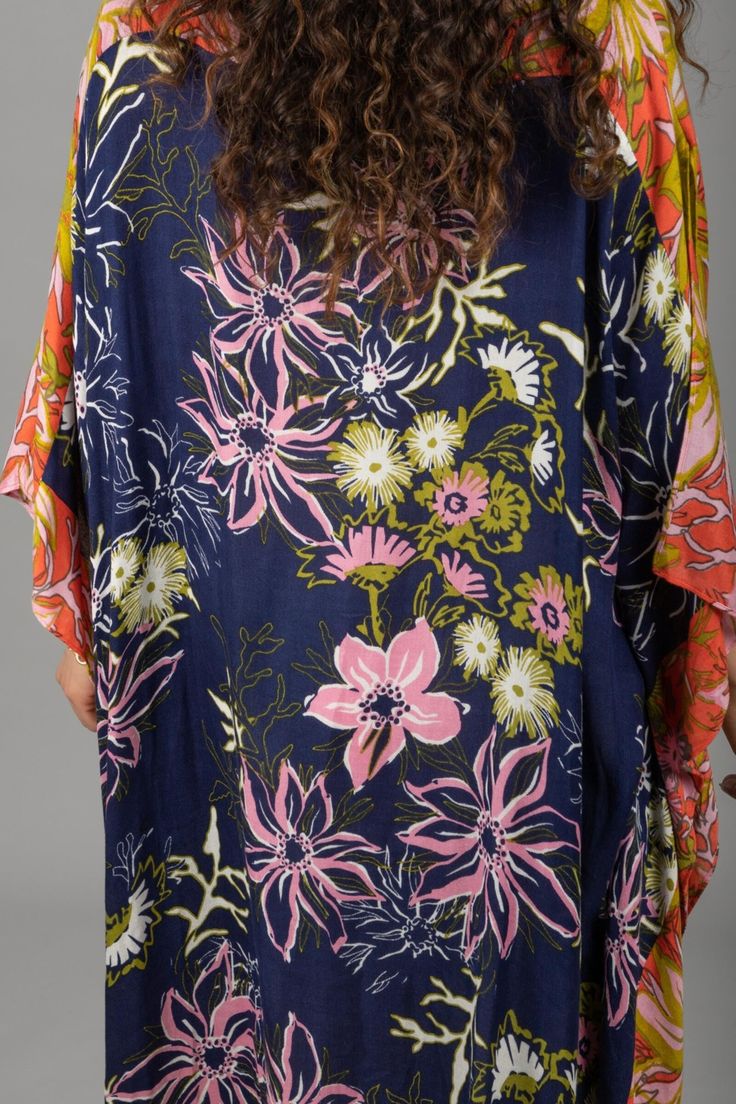 Our lovely Wildflower Kaftan showcases a range of floral motifs and delicate botanical elements in varying sizes and styles. The cinched sides of the garment create a unique drape that flatters all body types, enhancing natural beauty and complementing individual styles. The design also allows for easy movement, ensuring maximum comfort throughout the day. This kaftan, made from lightweight material, is the perfect choice for a luxurious and stylish outfit, whether you're lounging by the pool or Patterned Dresses With Kimono Sleeves For Summer, Casual Dresses With Kimono Sleeves For Brunch, Floral Print Patterned Beach Dress, Patterned Floral Print Beach Dresses, Patterned Dresses With Floral Print And Kimono Sleeves, Beach Dresses With Floral Print, Patterned Dress With Floral Print And Kimono Sleeves, Flowy Floral Print Dress For Beach, Flowy Floral Print Dress For The Beach