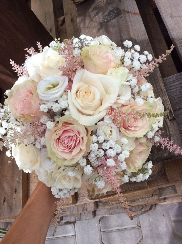 a bridal bouquet with pink and white flowers