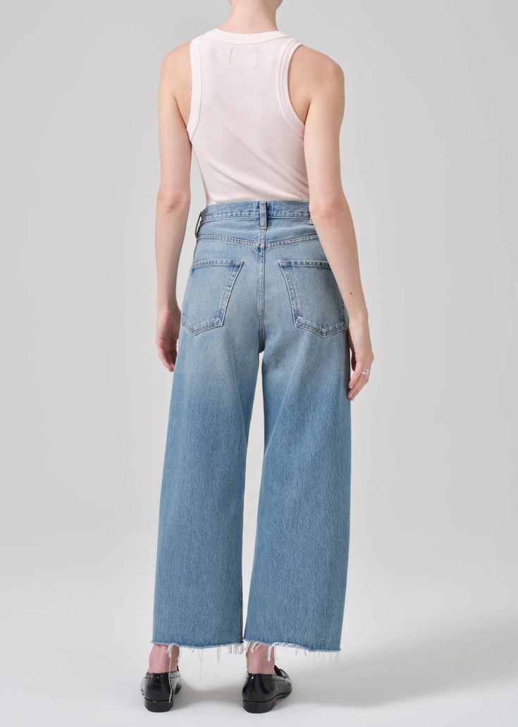 Inspired by our best-selling Ayla silhouette, the Ayla raw hem crop offers a relaxed rise, easy leg and cropped inseam. Style back to a classic white shirt for elevated ease. This style is true to size and intended to sit relaxed at the natural waist. For a higher and closer fit, we recommend sizing down. Looks Like: Vintage medium indigo with fading and a raw hem Feels Like: Non-stretch rigid regenerative cotton with a vintage hand This product is made with regenerative cotton from Citizens of Classic White Shirt, Jean Large, By Malene Birger, Light Wash Denim, Citizens Of Humanity, Thom Browne, Embroidered Shirt, Blazer Coat, Classic White