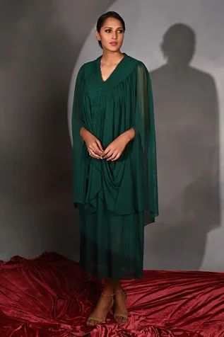 Shop for Jyoti Sachdev Iyer Green Lycra Cowl Draped Dress for Women Online at Aza Fashions Green Pleated Draped Dress, Formal Dress With Traditional Draped Sleeves, Pre-draped Dresses With Folds, Festive Dress With Draped Cape Sleeves, Festive Dresses With Draped Cape Sleeves, Formal Dress With Draped Sleeves, Fitted Dress With Draped Sleeves, Festive Green Draped Dresses, Festive Draped Cocktail Dress