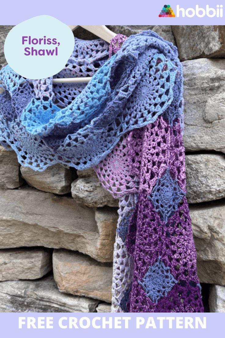 a purple and blue crochet shawl hanging on a stone wall with text overlay that says floriss shawl free crochet pattern